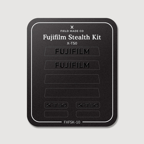 Stealth Kit for Fujifilm X-T50: Ghost Logo and Plain Black vinyl labels on the Field Made Co backing sheet