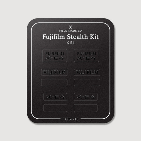 Stealth Kit for Fujifilm X-E4: Ghost Logo and Plain Black vinyl labels on the Field Made Co backing sheet