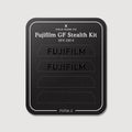 Stealth Kit for Fujifilm GFX 100 II: Ghost Logo and Plain Black vinyl labels on the Field Made Co backing sheet