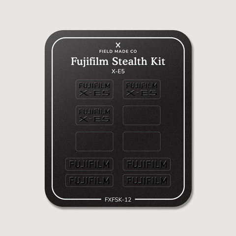 Stealth Kit for Fujifilm X-E5: Ghost Logo and Plain Black vinyl labels on the Field Made Co backing sheet
