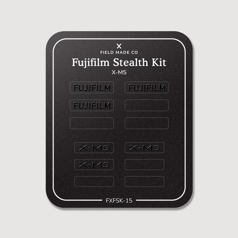 Stealth Kit for Fujifilm X-M5: Ghost Logo and Plain Black vinyl labels on the Field Made Co backing sheet