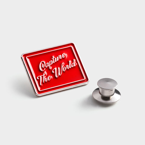 Capture the World Enamel Pin